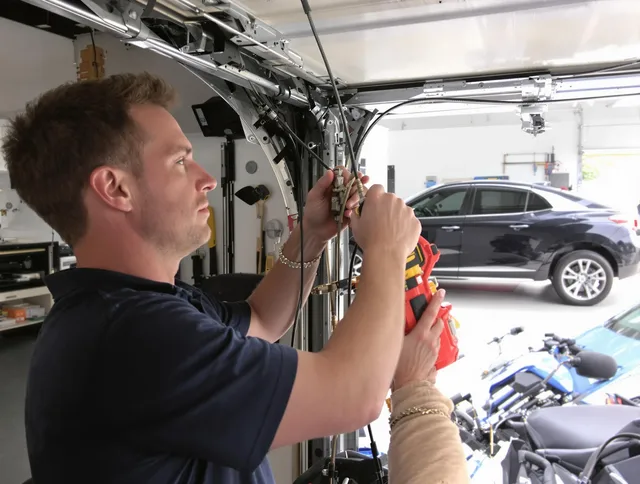 Lehigh Acres Garage Door Repair safety certified technician performing cable replacement in Lehigh Acres