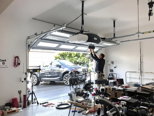 Lehigh Acres Garage Door Repair specialist installing smart garage door opener system in Lehigh Acres home