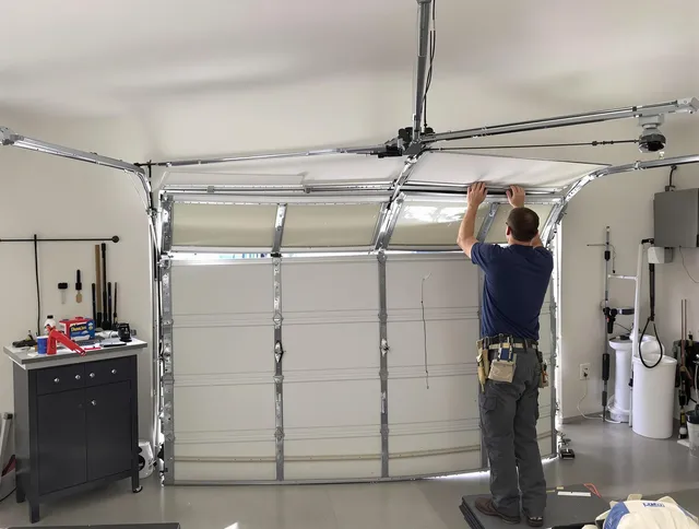 Lehigh Acres Garage Door Repair specialist performing precise section replacement on Lehigh Acres garage door